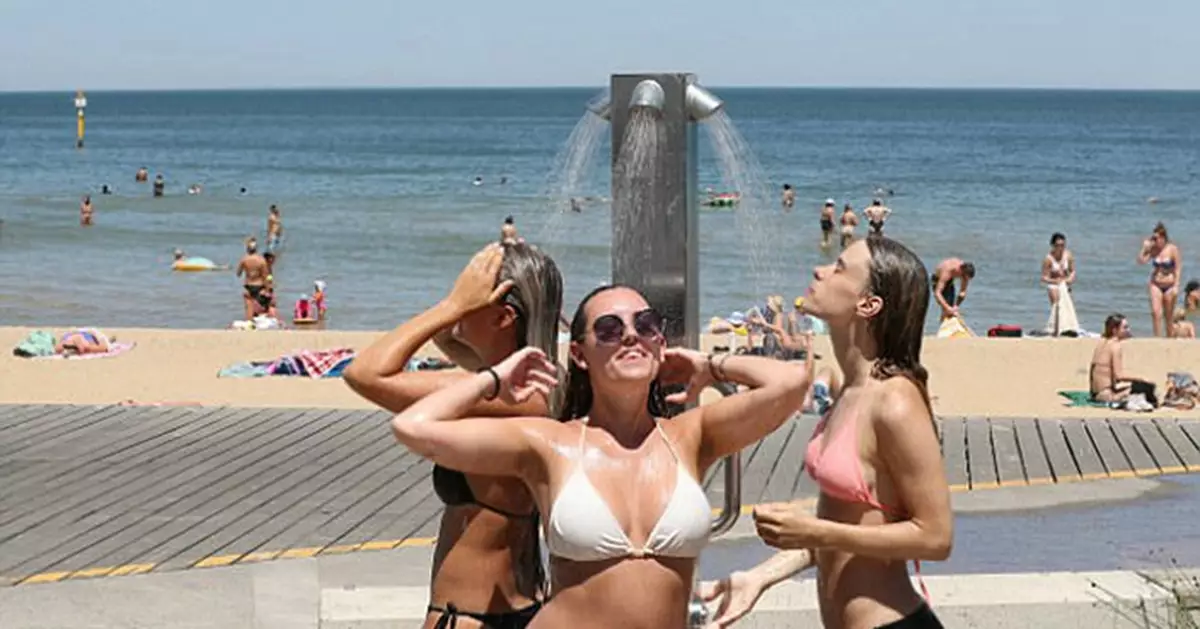 Australian women enjoy the cool with their bikinis under the extremely hot weather