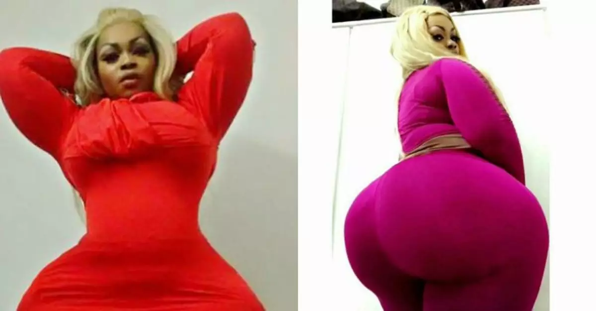 African woman proud of her extremely exaggerated body figure with 60-inch firm buttocks