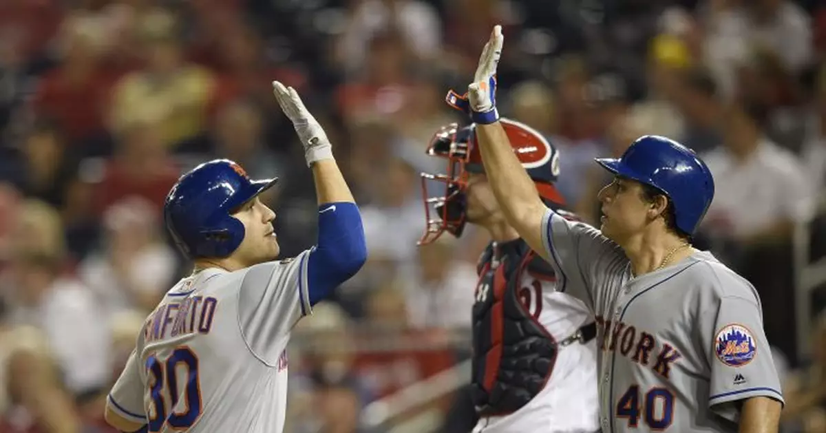 Lobaton's sacrifice fly lifts Mets past Nationals in 12