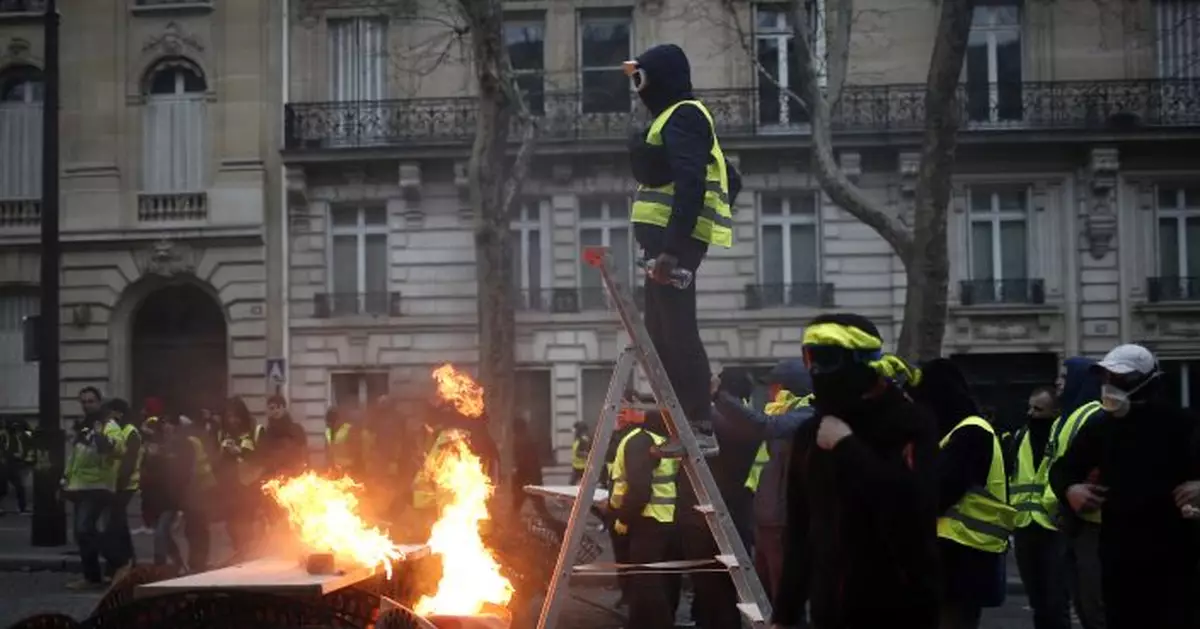AP FACT CHECK: Trump's trade claims, Paris protesters' chant