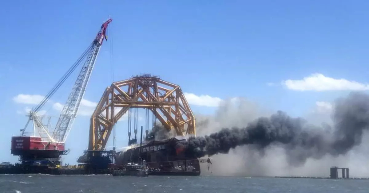 Flames engulf cargo ship&#039;s remains off US coast; no injuries