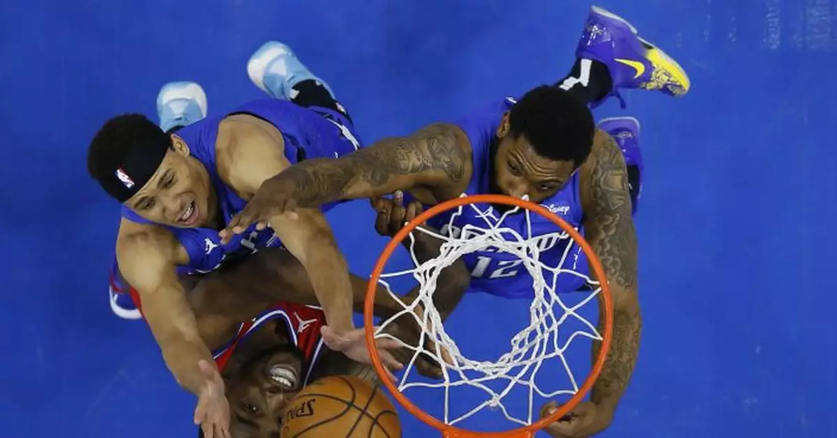 Curry, Embiid help 76ers top Magic, clinch top seed in East