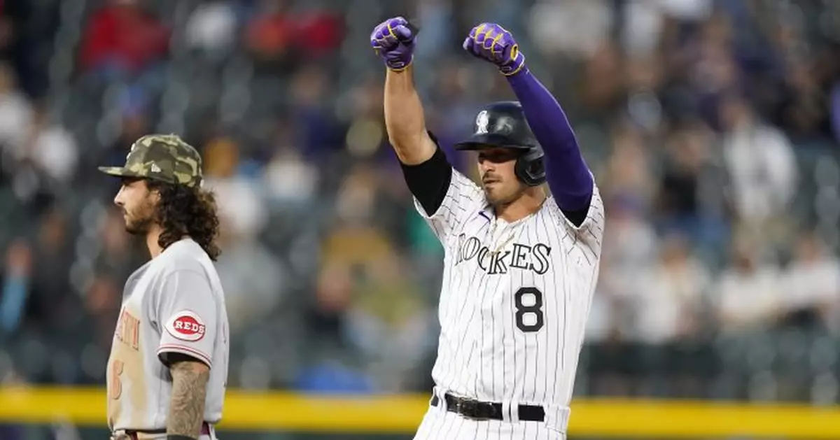 Hampson homers, triples as Rockies beat Reds 9-6