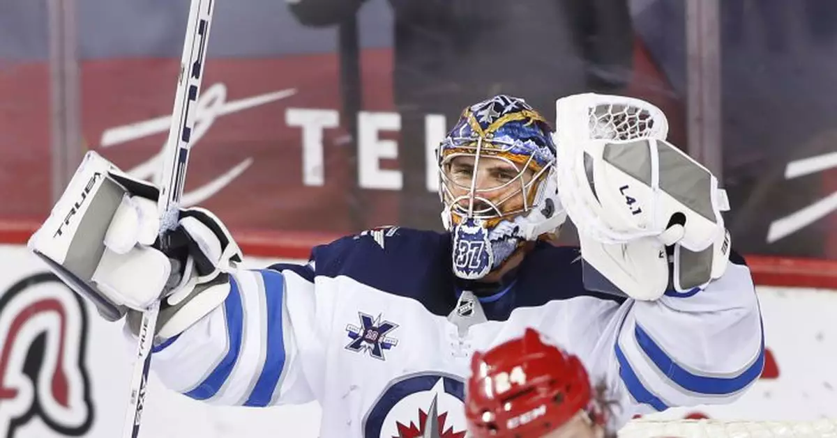 Jets clinch playoff spot, beating Flames to end skid