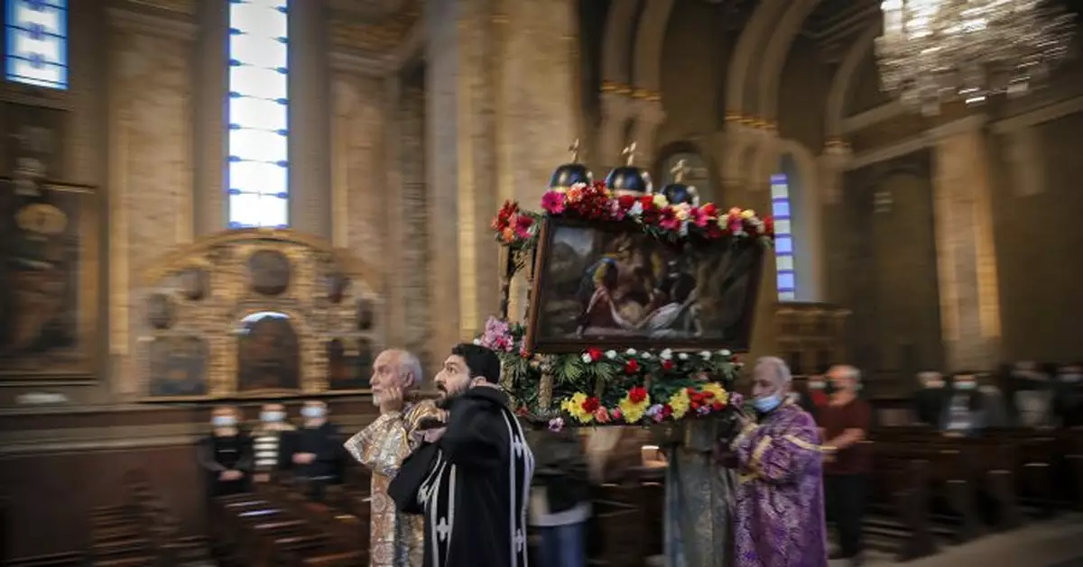 AP PHOTOS: Dwindling Armenians show Easter faith in Romania