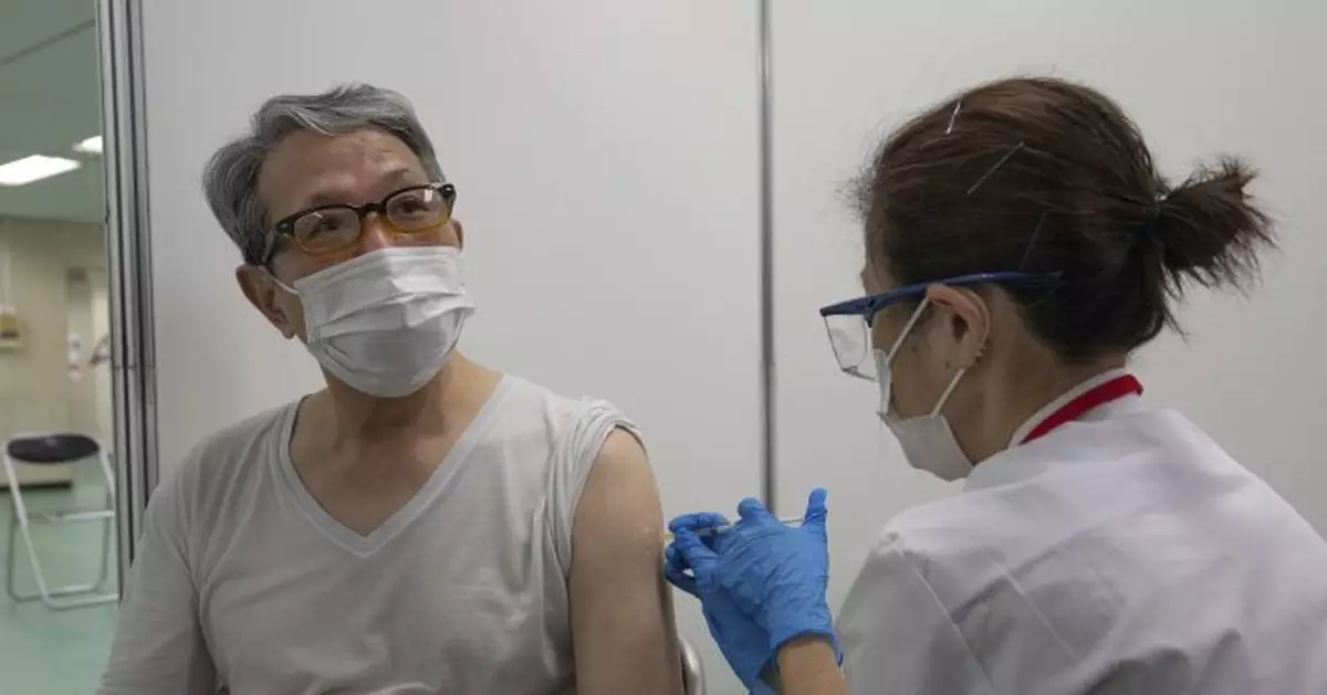 Japan opens mass vaccination centers 2 months before Games