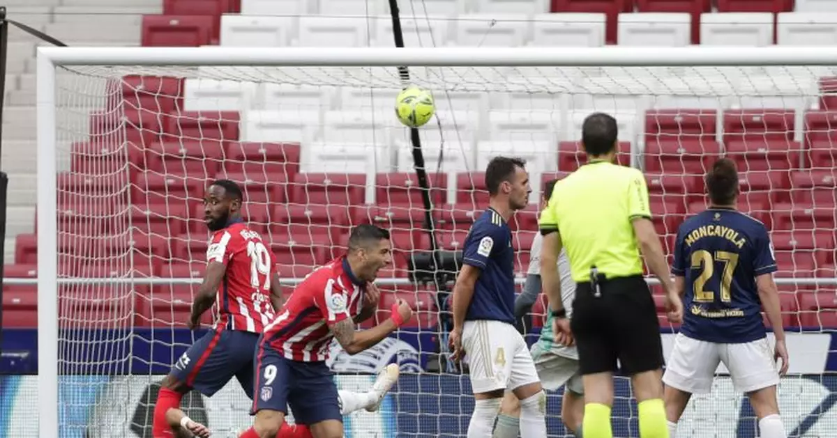 Late Suárez goal moves Atlético 1 win from league title
