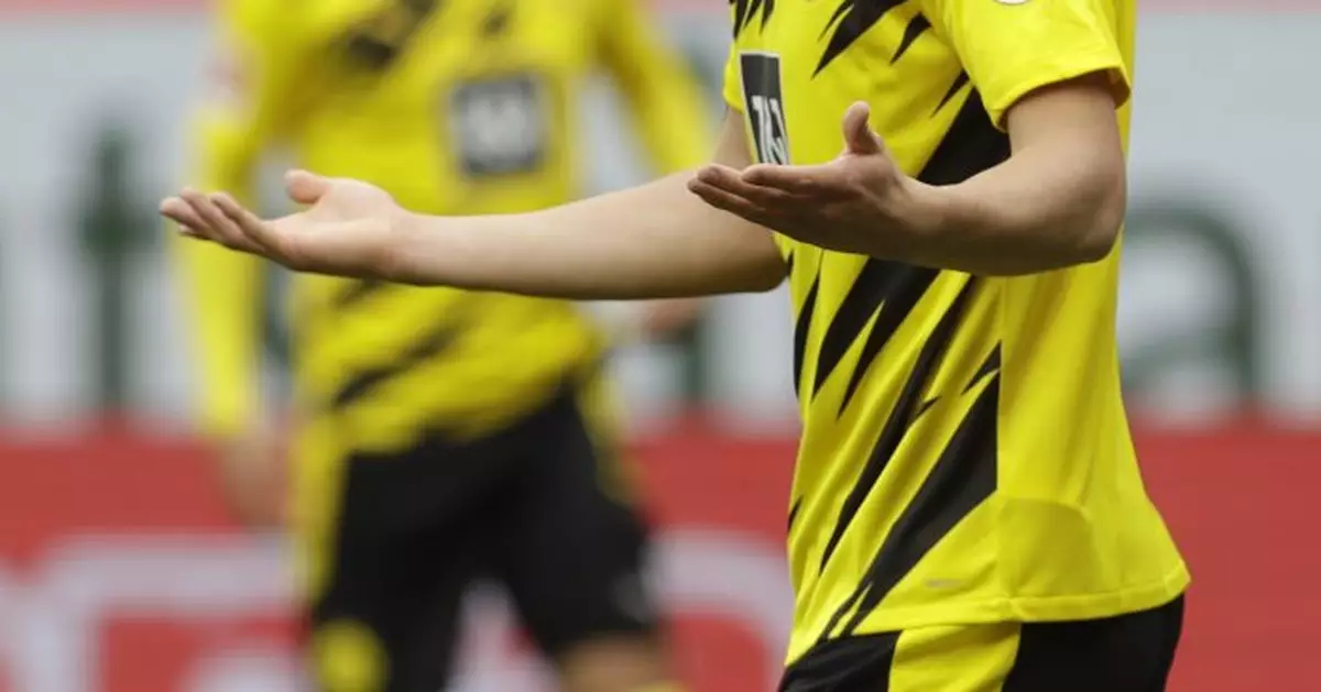 Dortmund secures Champions League spot with 3-1 win at Mainz