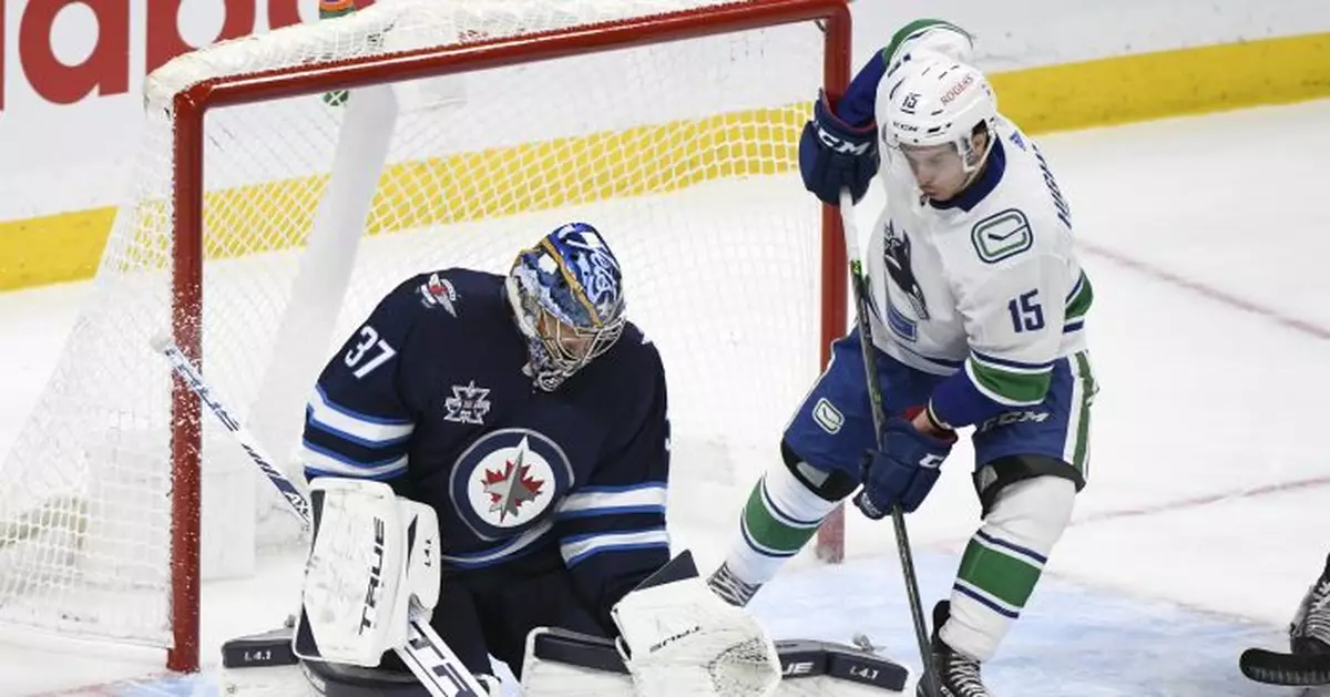 Jets beat Canucks 5-0 to secure 3rd in North Division