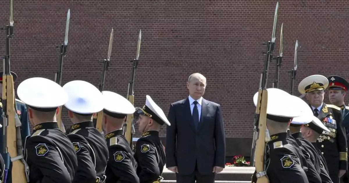 Putin hails WW II heroes, warns of degrading Europe security
