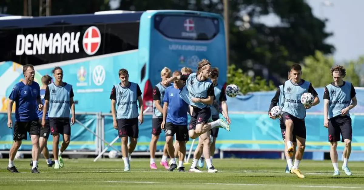 The Latest: Denmark gets back on the field at Euro 2020