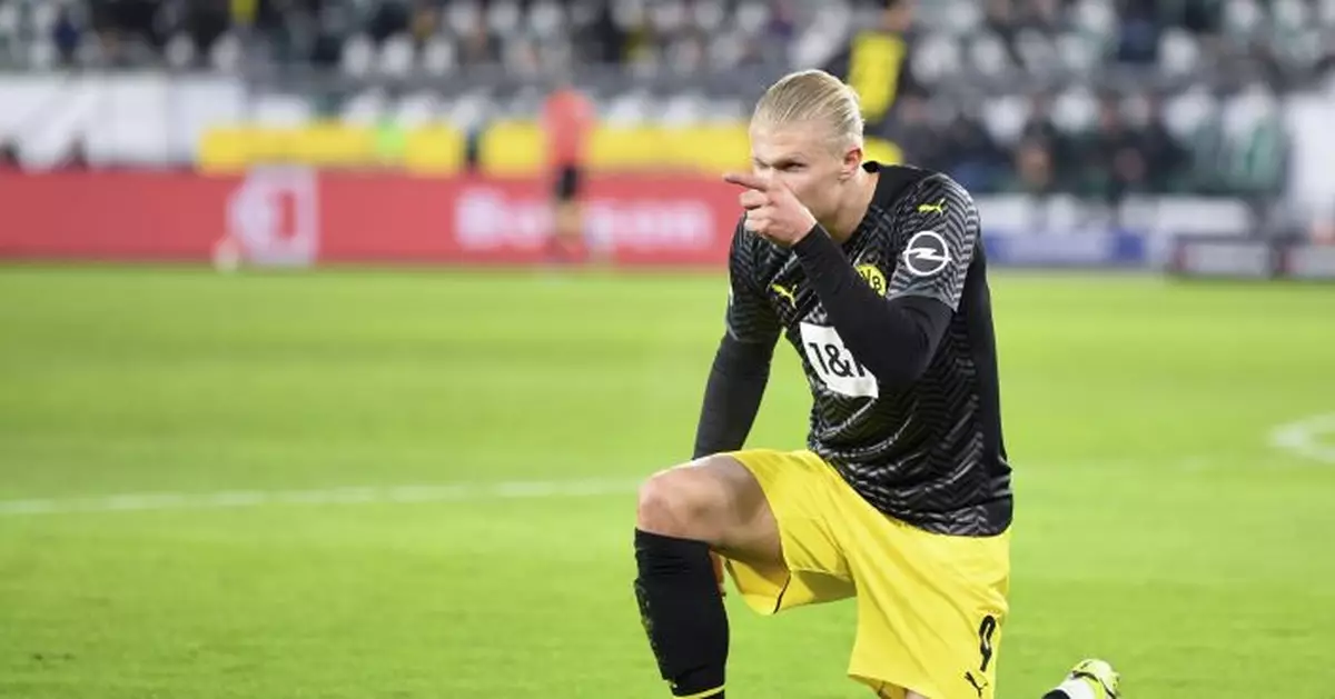 Haaland scores on return to help Dortmund to Bundesliga lead