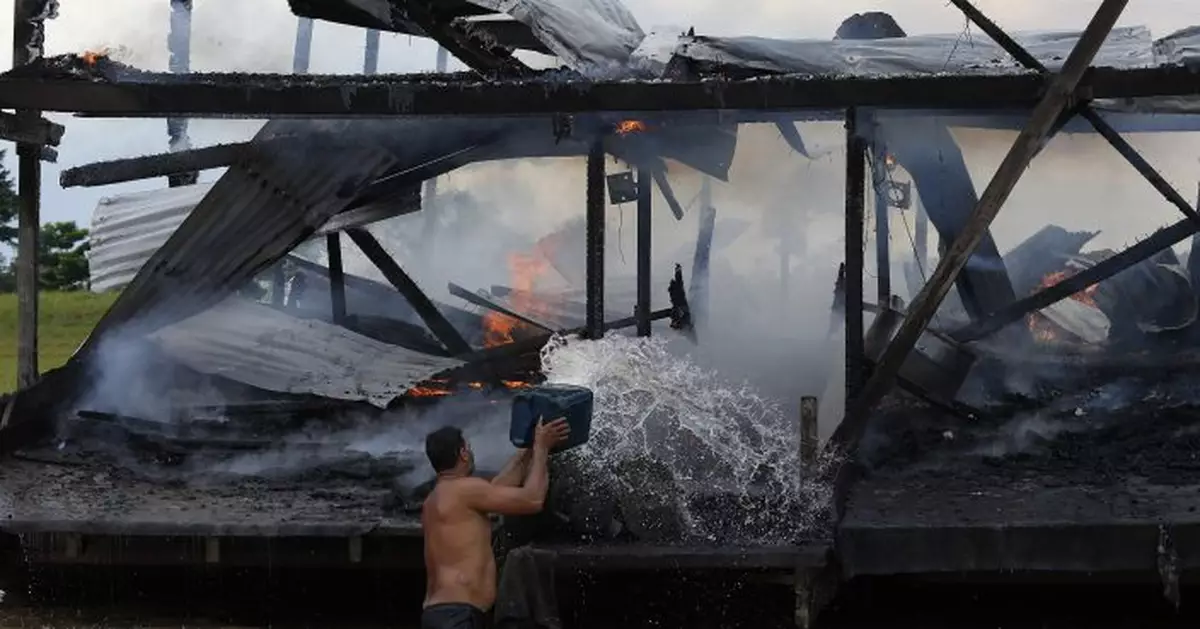 Police burn miners&#039; boats in Brazil&#039;s Amazon, upping tension