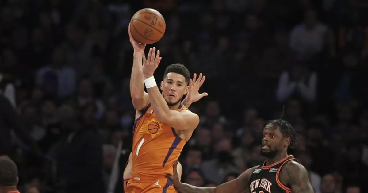 Booker, Suns extend win streak to 15, beat Knicks 118-97