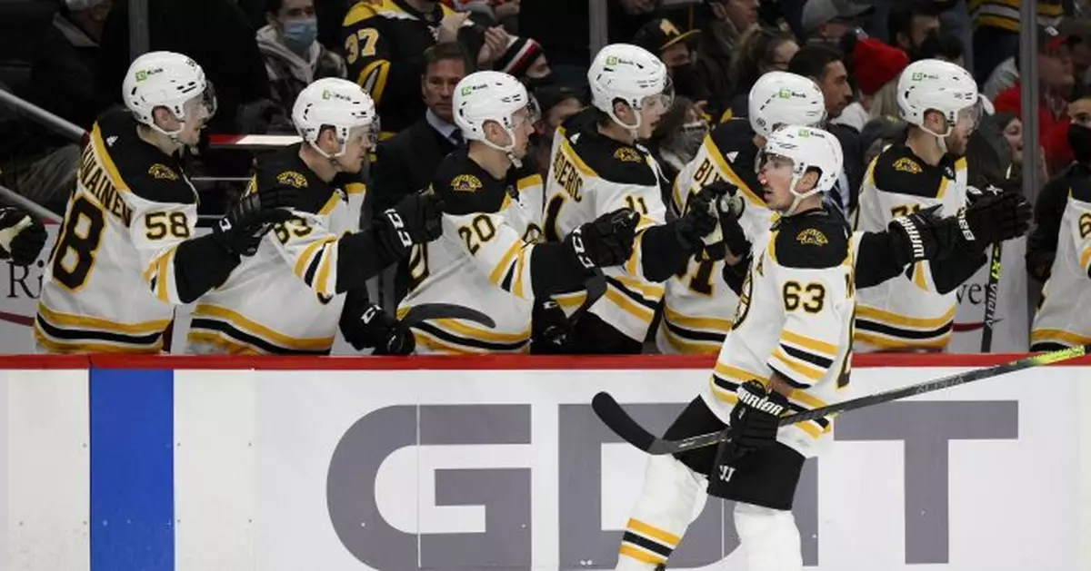 Marchand bloodied, scores twice in Bruins&#039; 7-3 win over Caps
