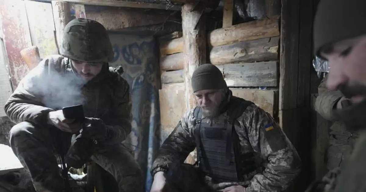 In eastern Ukraine, villagers and troops await next moves