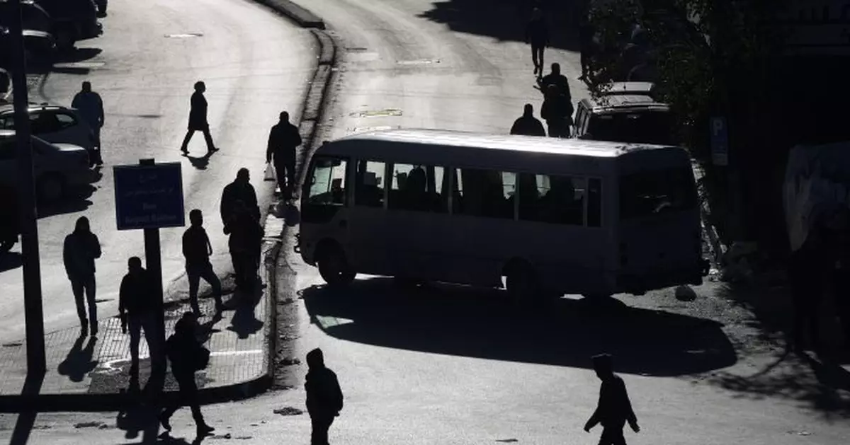 Lebanon&#039;s taxi, bus and van drivers block roads in protest