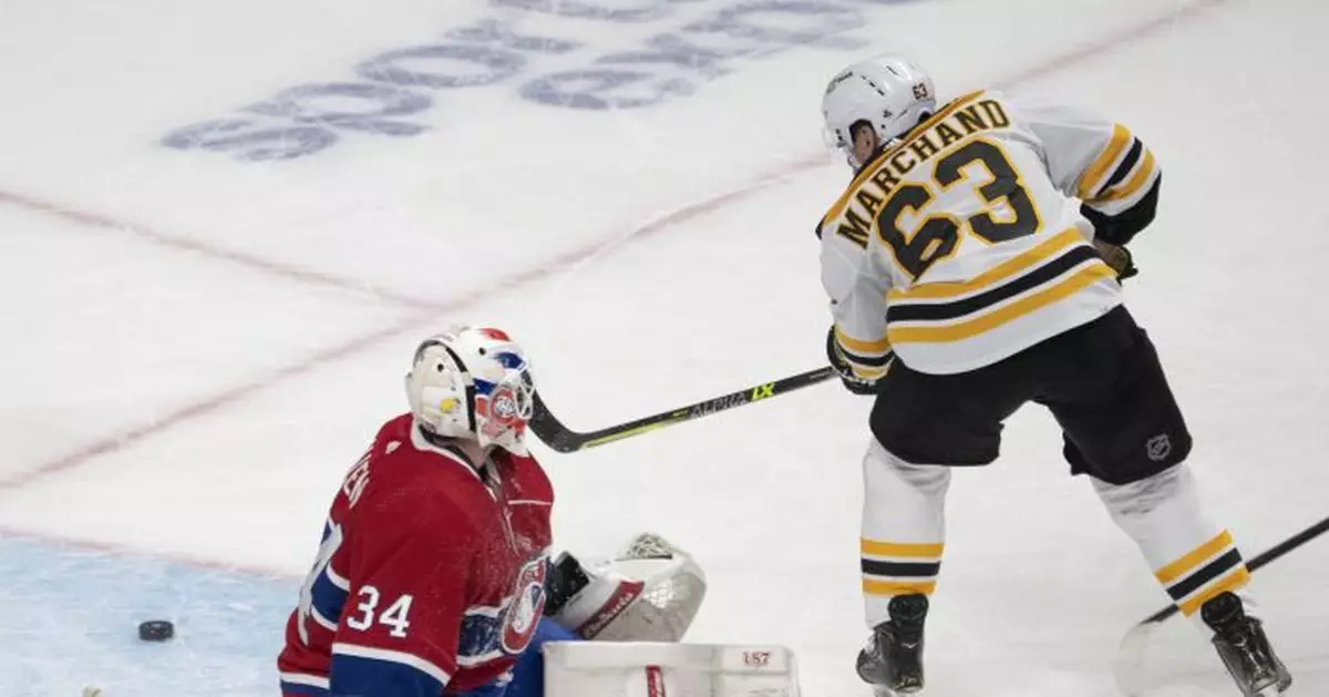 Marchand scores 2, lifts Bruins past Canadiens in OT