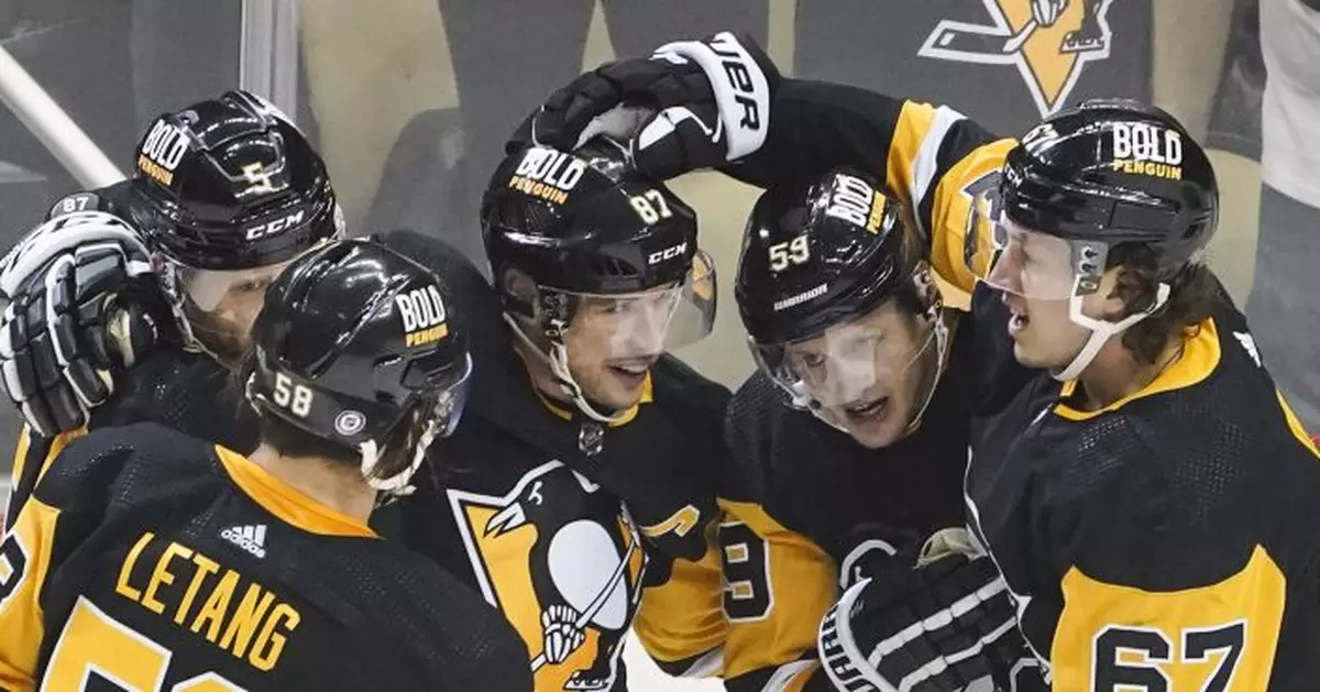 Crosby scores in OT for 1,400th point, Penguins beat Preds