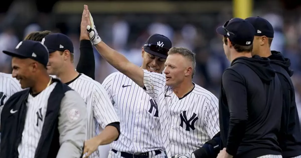 Donaldson, Yankees beat Red Sox in 11-inning opener