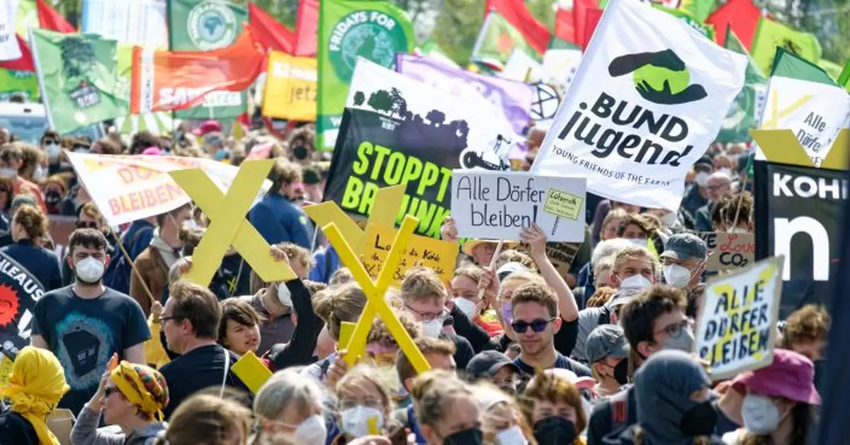 Thousands protest plan to raze German village for coal mine