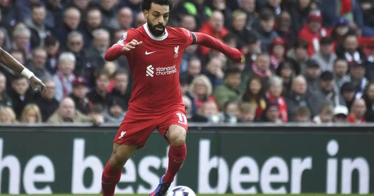 Salah fires title-chasing Liverpool to 2-1 win against Brighton, top of the standings