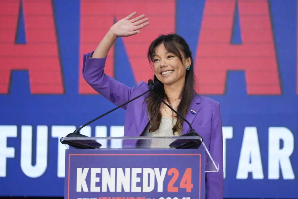 Nicole Shanahan waves from the podium during a campaign event for Presidential candidate Robert F. Kennedy Jr., Tuesday, March 26, 2024, in Oakland, Calif. Shanahan has been picked as Kennedy Jr.'s running mate. (AP Photo/Eric Risberg)