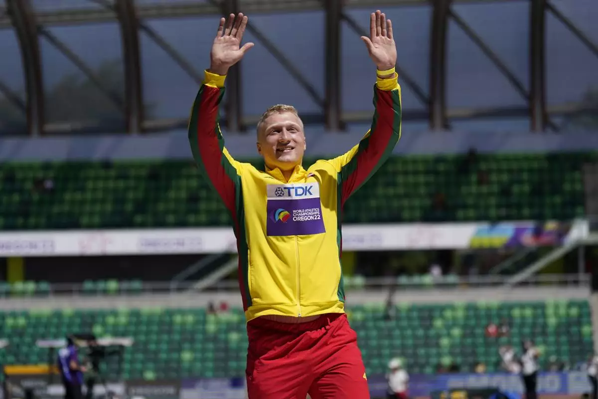 FILE - Silver medalist Mykolas Alekna, of Lithuania, celebrates during a medal ceremony for the discus throw at the World Athletics Championships, July 20, 2022, in Eugene, Ore. Alekna broke a world record in the discus throw that had stood since 1986 on Sunday, April 14, 2024, at the Oklahoma Throws Series competition. (AP Photo/Ashley Landis, File)