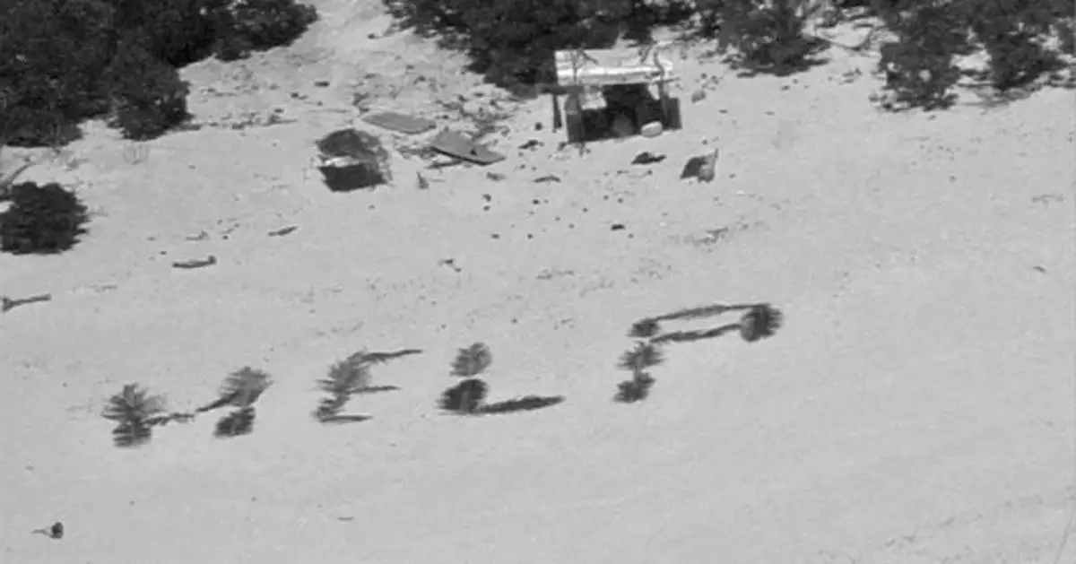'HELP' sign on beach points rescuers to men stuck nine days on remote Pacific atoll