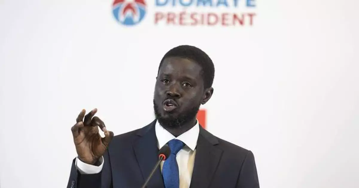 Senegal swears in Africa's youngest elected leader as president in a dramatic prison-to-palace rise