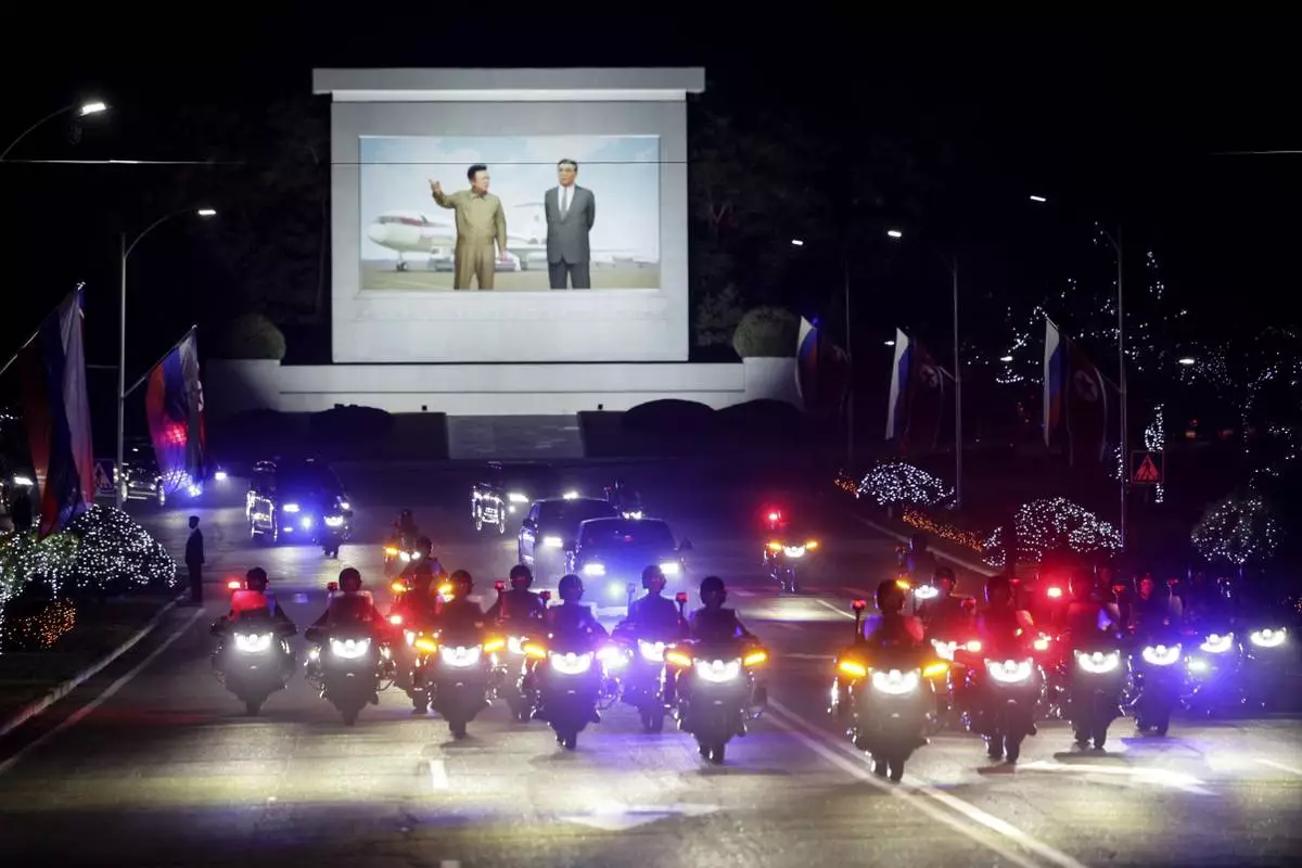 CORRECTS DATE TO EARLY WEDNESDAY, JUNE 19 - A motorcade with Russian President Vladimir Putin and North Korea's leader Kim Jong Un rolls from the Pyongyang Sunan International Airport outside Pyongyang, North Korea, early Wednesday, June 19, 2024. (Gavriil Grigorov, Sputnik, Kremlin Pool Photo via AP)