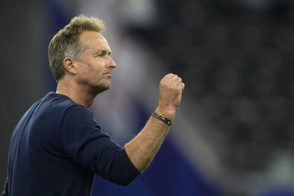 Denmark head coach Kasper Hjulmand gestures after the Group C match between Denmark and England during the Euro 2024 soccer tournament in Frankfurt, Germany, Thursday, June 20, 2024. (AP Photo/Michael Probst)