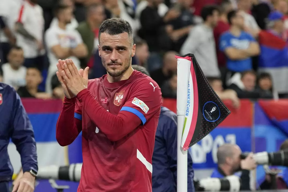 Serbian Filip Kostic leaves the field after being substituted during the Group C match between Serbia and England during the Euro 2024 soccer tournament in Gelsenkirchen, Germany, Sunday, June 16, 2024. (AP Photo/Andreea Alexandru)