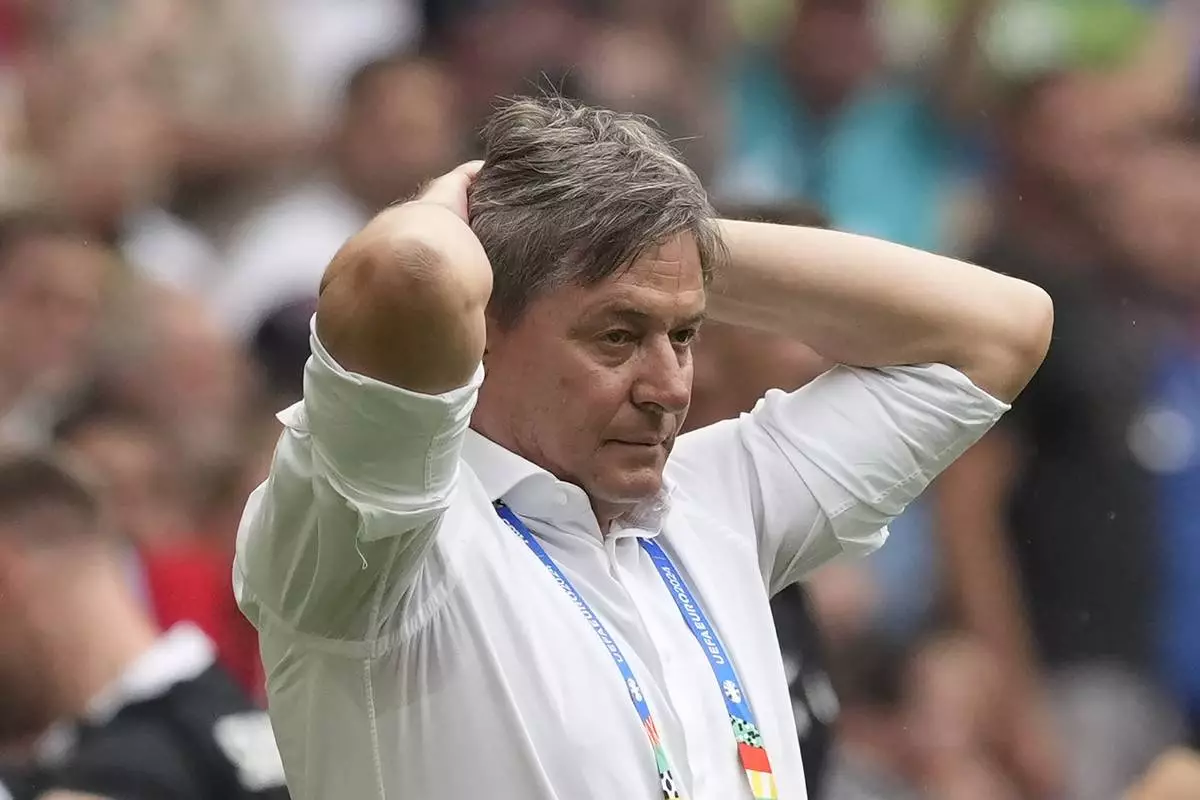 Serbia head coach Dragan Stojkovic reacts after Slovenia scored a goal during the Group C match between Slovenia and Serbia during the Euro 2024 soccer tournament in Munich, Germany, Thursday, June 20, 2024. (AP Photo/Antonio Calanni)