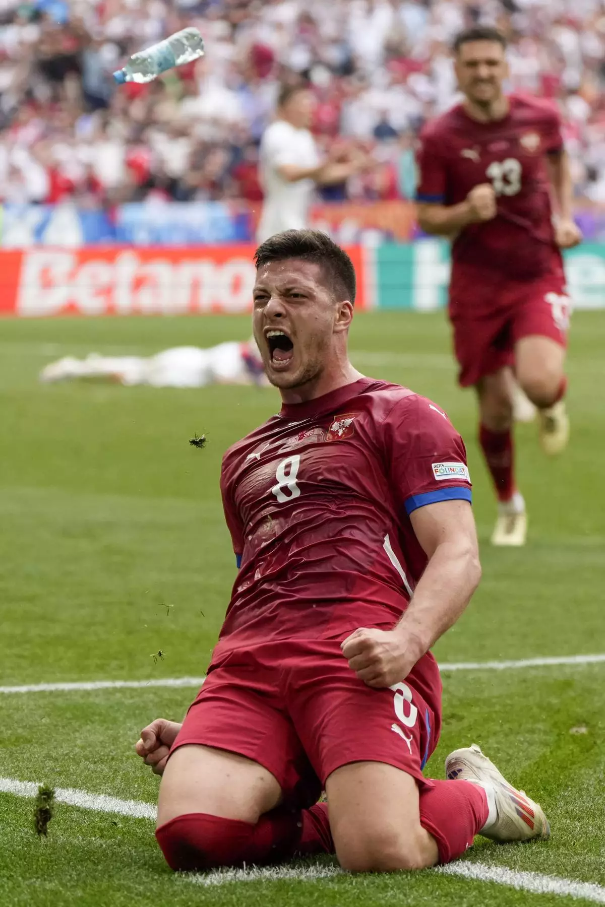 Serbia's Luka Jovic celebrates after scoring his first goal for the team during the Group C match between Slovenia and Serbia at the Euro 2024 soccer tournament in Munich, Germany, Thursday, June 20, 2024. (AP Photo/Matthias Schrader)