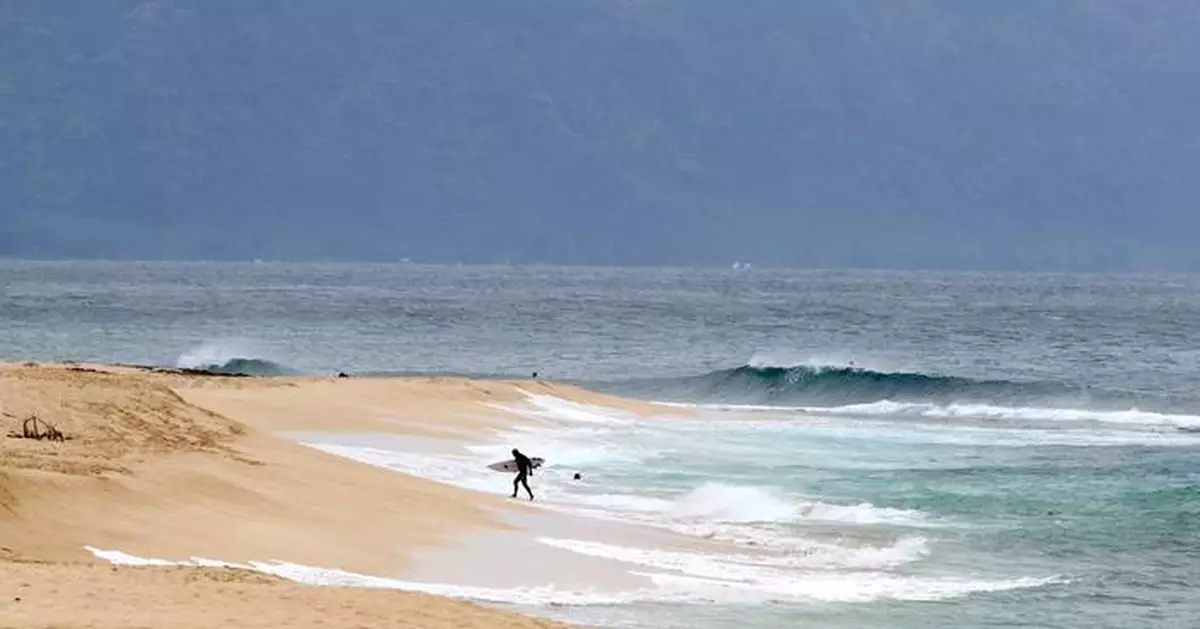 Former pro surfer known for riding huge Pipeline waves dies in shark attack while surfing off Oahu