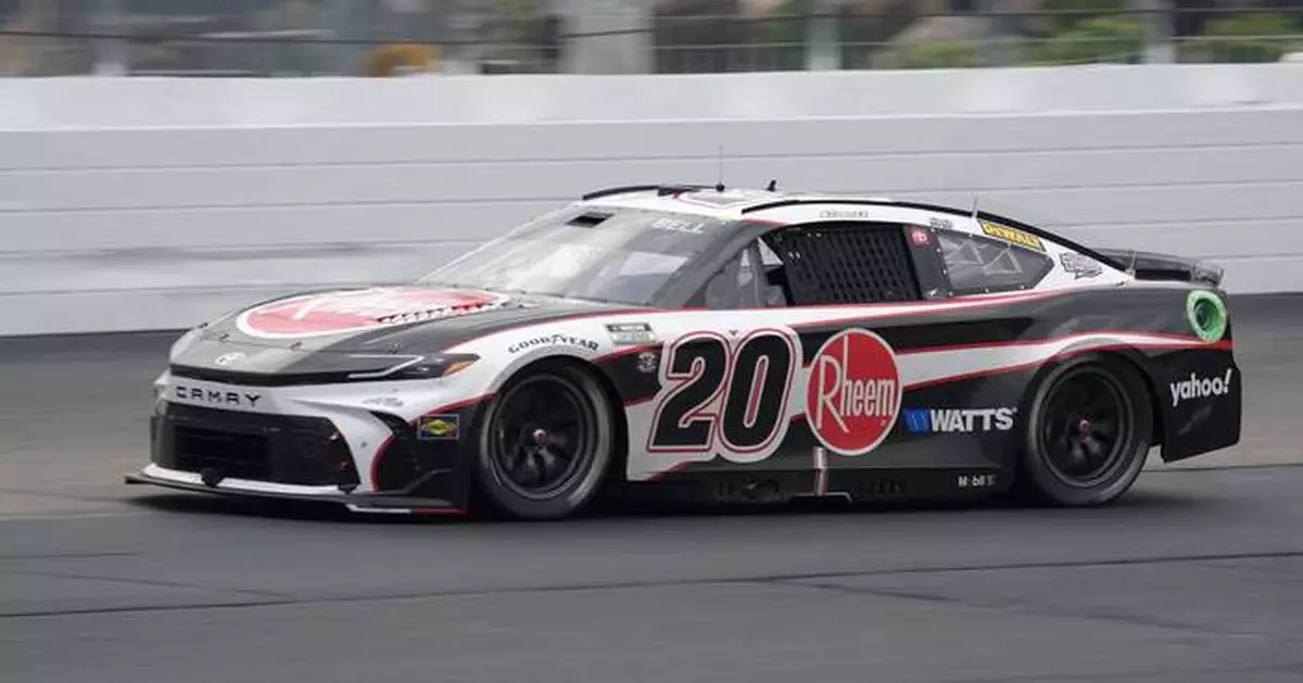 Christopher Bell takes the checkered flag on rain tires in the NASCAR Cup race at New Hampshire