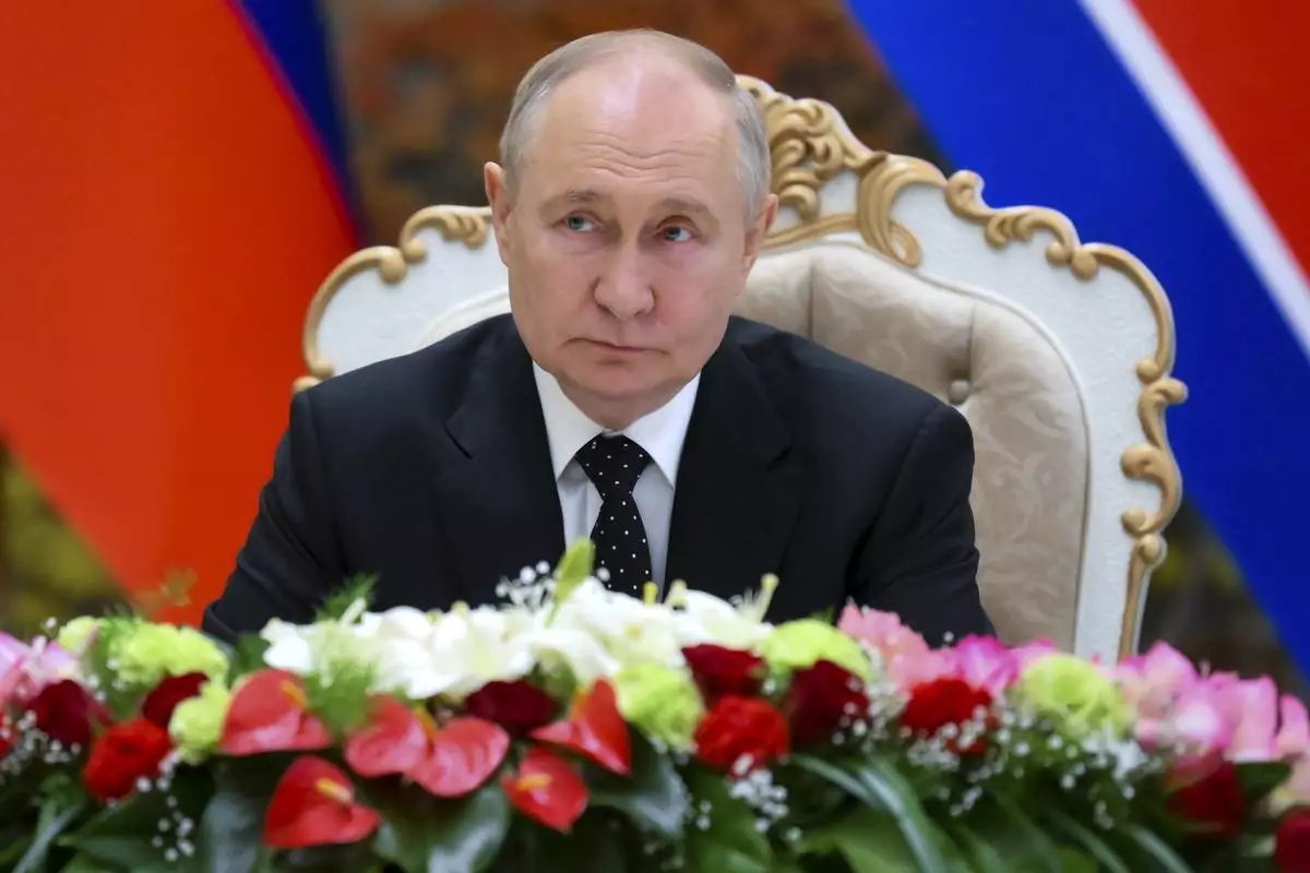 Russian President Vladimir Putin attends a signing ceremony of the new partnership with North Korea's leader Kim Jong Un in Pyongyang, North Korea, on Wednesday, June 19, 2024. Putin and North Korean leader Kim Jong Un signed a new partnership that includes a vow of mutual aid if either country is attacked, during a Wednesday summit that came as both face escalating standoffs with the West. (Kristina Kormilitsyna, Sputnik, Kremlin Pool Photo via AP)