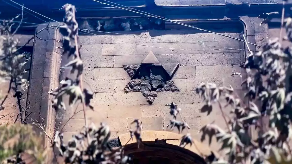 In this photo taken from video released by The Telegram Channel of the head of Dagestan Republic of Russia on Monday, June 24, 2024, A damaged by terrorists David's star is seen on the wall of the the Kele-Numaz synagogue in Derbent after a counter-terrorist operation in republic of Dagestan, Russia. Multiple police officers and several civilians, including an Orthodox priest, were killed by armed militants in Russia's southern republic of Dagestan on Sunday, its governor Sergei Melikov said in a video statement early Monday. (The Telegram Channel of the head of Dagestan Republic of Russia via AP)