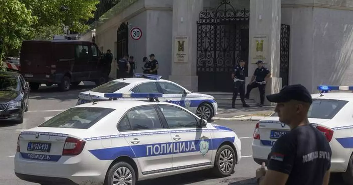 Crossbow attacker wounds a police officer guarding Israel's embassy in Serbia before being shot dead