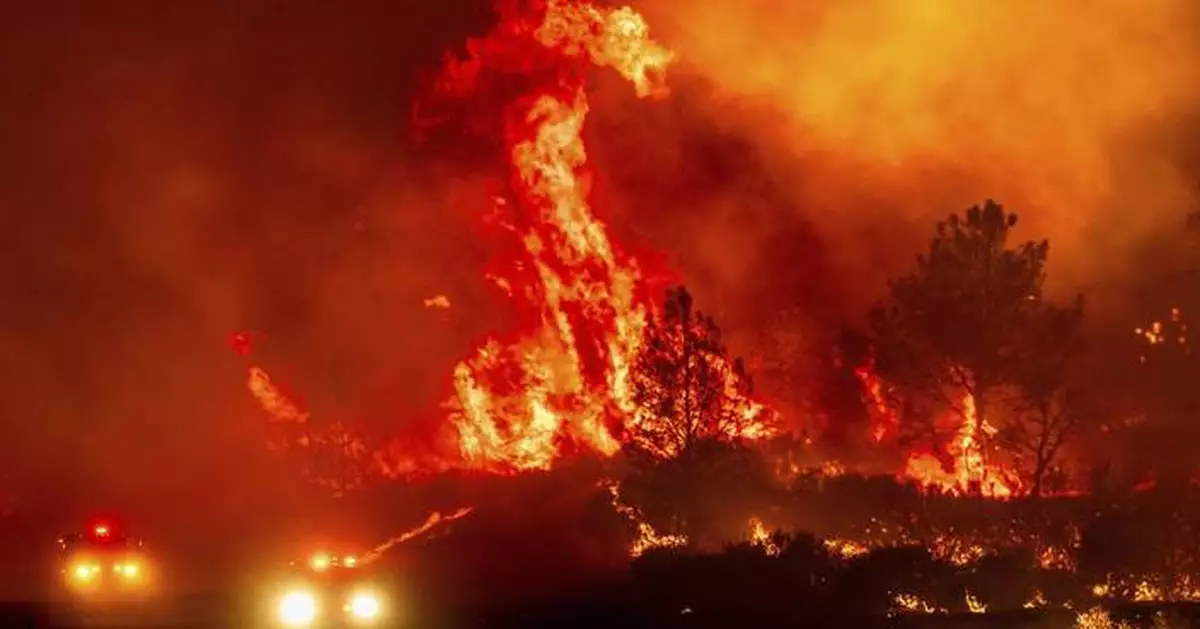 Firefighters helped by cooler weather battle blaze that has scorched area size of Los Angeles