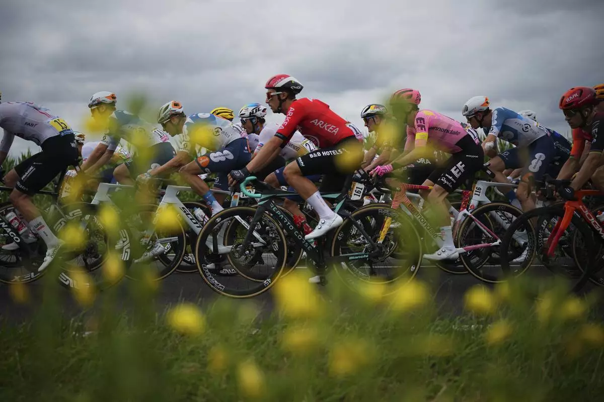 AP PHOTOS: The race to capture fleeting scenes from the Tour de France