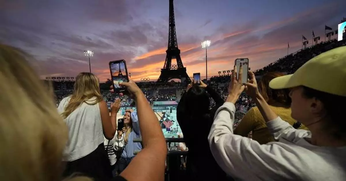 Beach volleyball at Eiffel Tower stadium draws the crowds looking for the perfect social media post