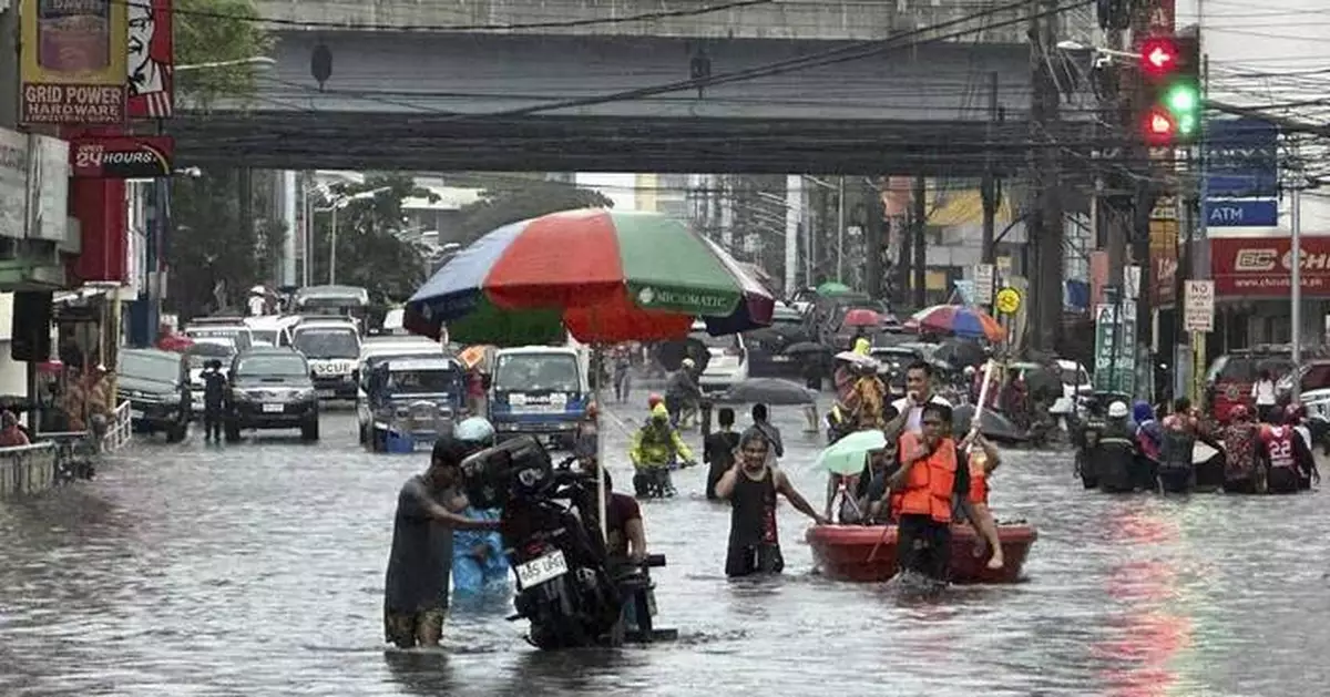 A typhoon kills 3 as it nears Taiwan. It killed 13 in the Philippines, where people plead for rescue