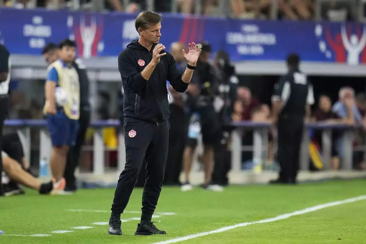 Canada head coach Jesse Marsch reacts on the sideline during a Copa America quarterfinal soccer match between Venezuela and Canada, Friday, July 5, 2024, in Arlington, Texas. (AP Photo/Julio Cortez)