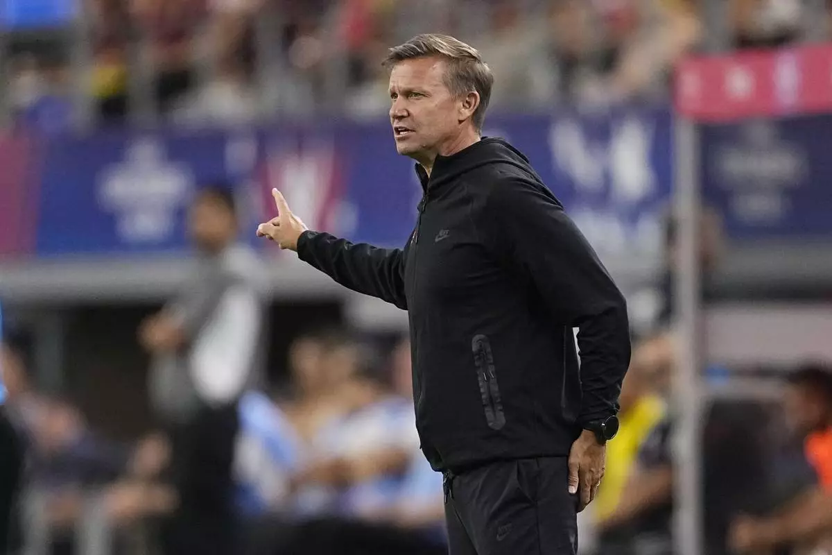 Canada head coach Jesse Marsch signals to his players during a Copa America quarterfinal soccer match between Venezuela and Canada in Arlington, Texas, Friday, July 5, 2024. (AP Photo/Tony Gutierrez)