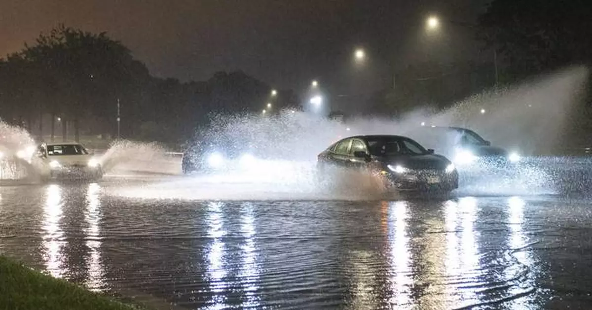 A dam fails after rain, wind, tornadoes pound the Midwest. The Chicago area is cleaning up