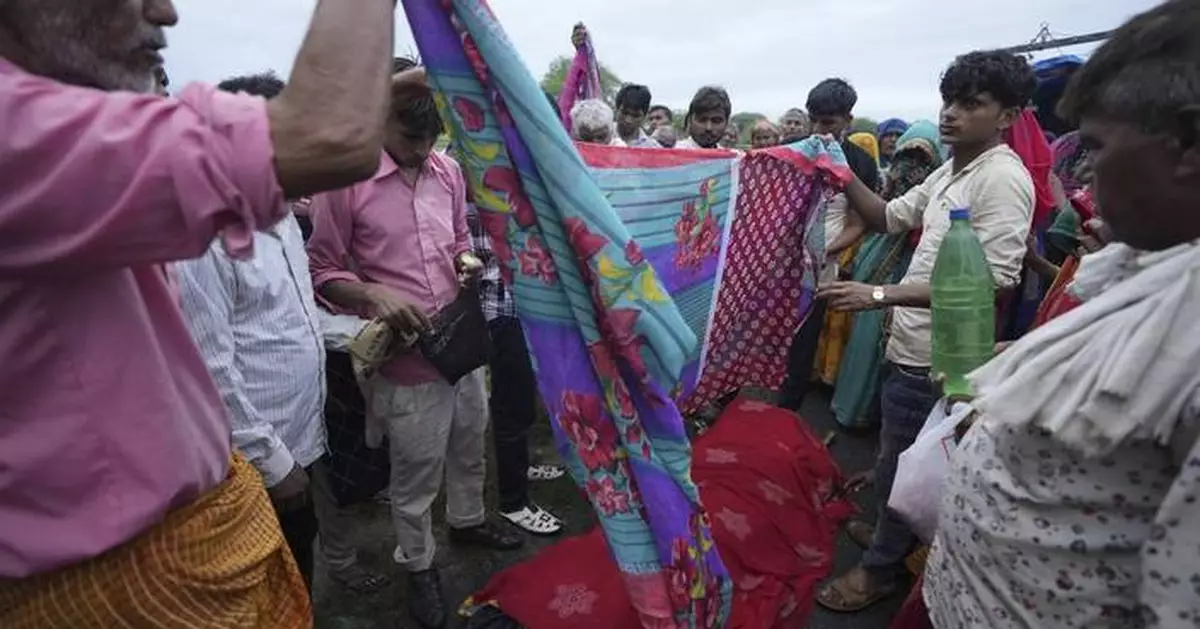 AP PHOTOS: Families of stampede victims in India ponder future without loved ones