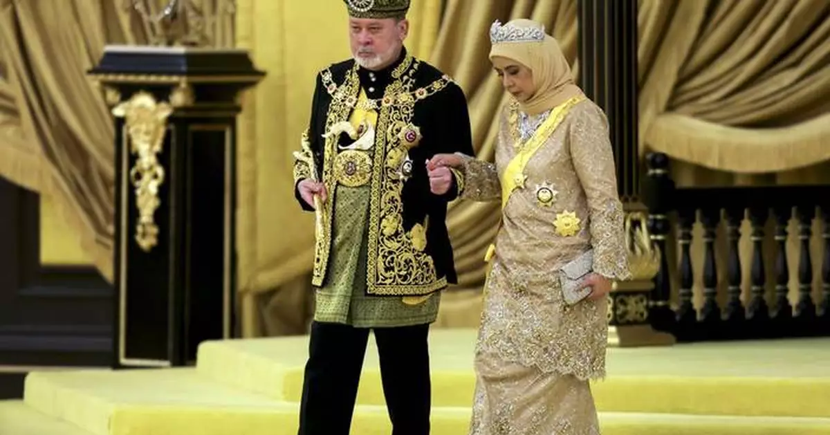 Malaysia honors a new king in coronation marked by pomp and cannon fire