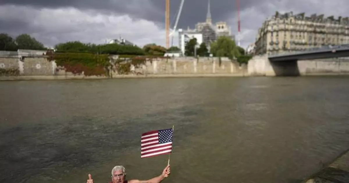 An American swims in Paris' Seine River before the Olympics despite contamination concerns